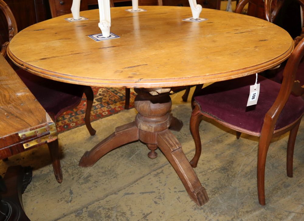 A Continental circular pine breakfast table, diameter 110cm, H.74cm